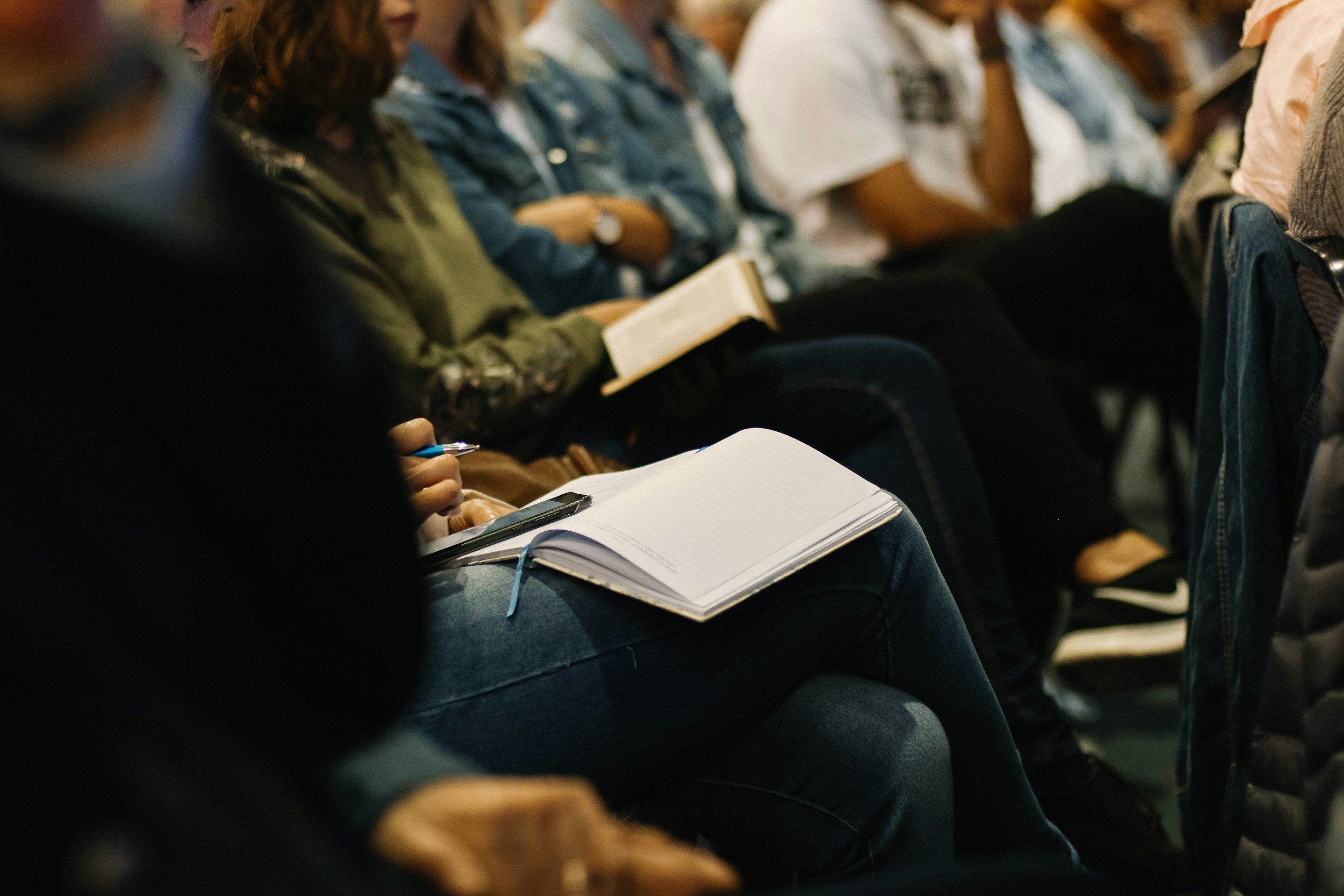 Students in audience with notebooks